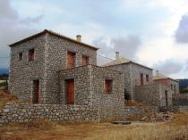 New built stone houses (100m2 each) set on a plot of land measuring \n	2000m2 with excellent views to the sea.