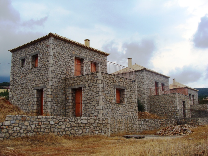 New built stone houses (100m2 each) set on a plot of land measuring \n	2000m2 with excellent views to the sea.